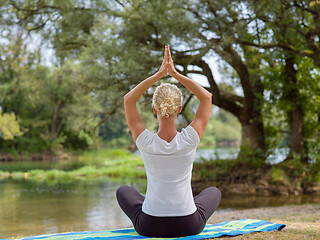 Image showing woman meditating and doing yoga exercise