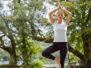 Image showing woman meditating and doing yoga exercise