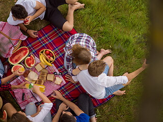 Image showing top view of group friends enjoying picnic time