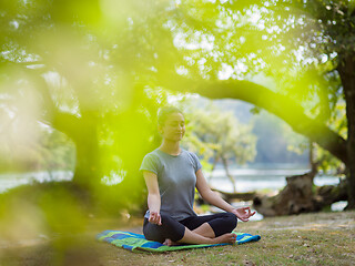 Image showing woman meditating and doing yoga exercise