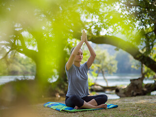 Image showing woman meditating and doing yoga exercise