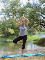 Image showing woman meditating and doing yoga exercise