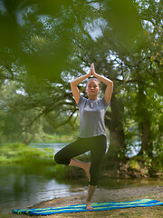 Image showing woman meditating and doing yoga exercise