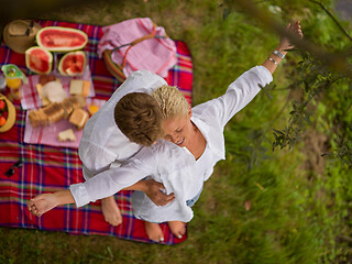 Image showing top view of couple enjoying picnic time