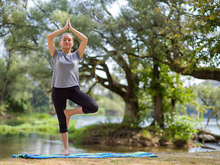 Image showing woman meditating and doing yoga exercise