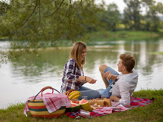 Image showing Couple in love enjoying picnic time