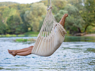 Image showing blonde woman resting on hammock