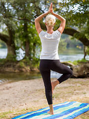 Image showing woman meditating and doing yoga exercise