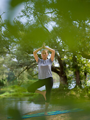 Image showing woman meditating and doing yoga exercise