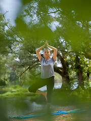 Image showing woman meditating and doing yoga exercise