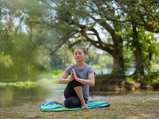 Image showing woman meditating and doing yoga exercise