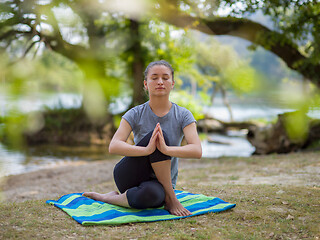 Image showing woman meditating and doing yoga exercise