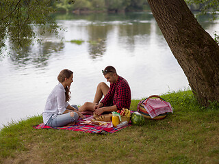 Image showing Couple in love enjoying picnic time