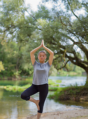 Image showing woman meditating and doing yoga exercise