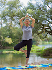 Image showing woman meditating and doing yoga exercise