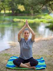 Image showing woman meditating and doing yoga exercise