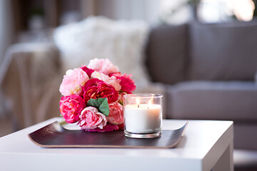 Image showing burning fragrance candle and flower bunch at home