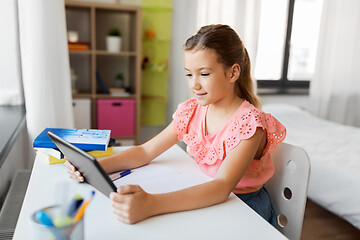 Image showing student girl using tablet computer at home