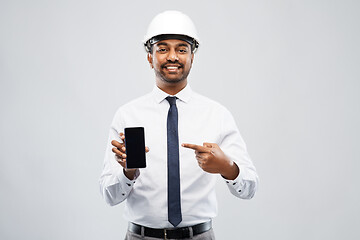 Image showing indian male architect in helmet showing smartphone