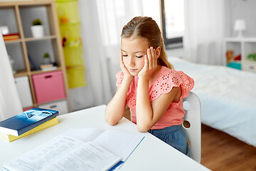 Image showing sad student girl with notebook at home