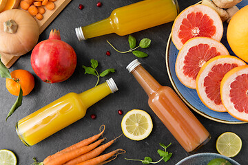 Image showing glass bottles of fruit and vegetable juices