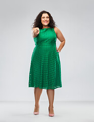 Image showing woman in green dress pointing finger to camera