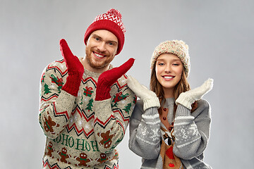 Image showing happy couple at christmas ugly sweater party