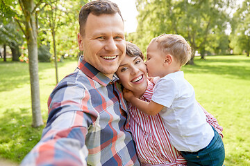 Image showing happy family taking selfie at summer park