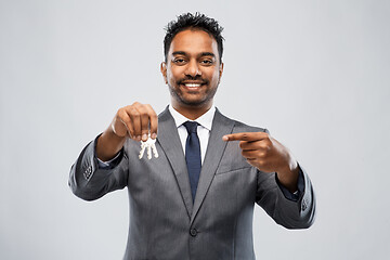 Image showing indian man realtor with keys and folder