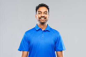 Image showing indian man in blue polo shirt over gray background