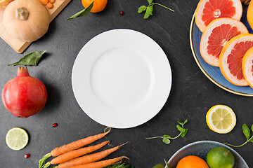 Image showing plate, vegetables and fruits on on slate table