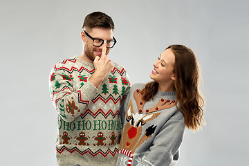 Image showing happy couple at christmas ugly sweater party