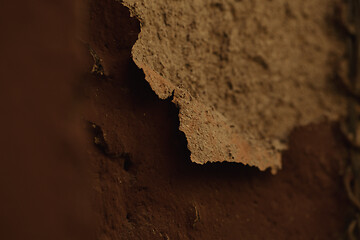 Image showing Detail of flaking old rough cast plaster