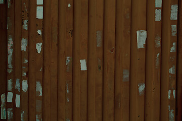 Image showing Wooden wall or fence with poster remnants