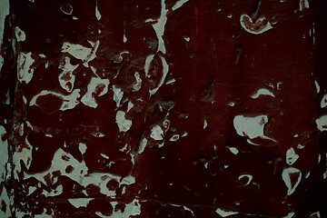 Image showing Old wooden panel with grungy peeling dark paint