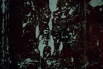 Image showing Old weathered peeling black paint on wooden panel