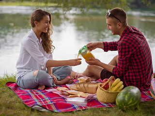 Image showing Couple in love enjoying picnic time