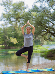 Image showing woman meditating and doing yoga exercise