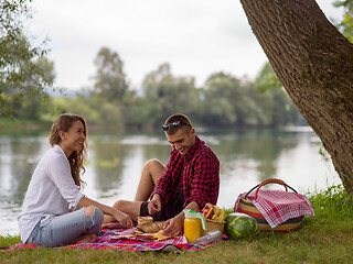 Image showing Couple in love enjoying picnic time