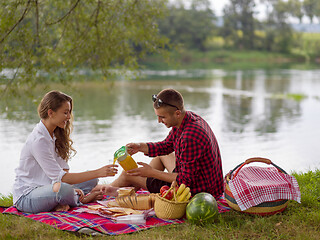 Image showing Couple in love enjoying picnic time