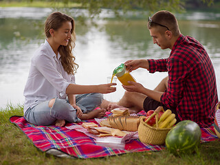 Image showing Couple in love enjoying picnic time