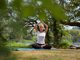 Image showing woman meditating and doing yoga exercise