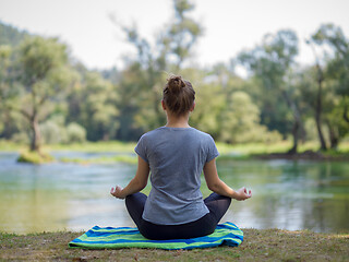 Image showing woman meditating and doing yoga exercise