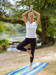 Image showing woman meditating and doing yoga exercise