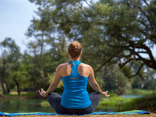 Image showing woman meditating and doing yoga exercise