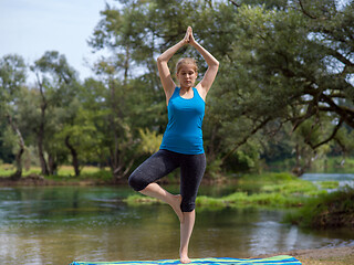 Image showing woman meditating and doing yoga exercise