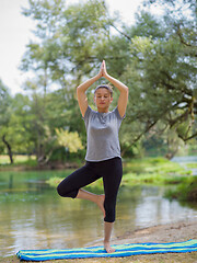 Image showing woman meditating and doing yoga exercise