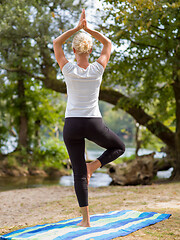 Image showing woman meditating and doing yoga exercise