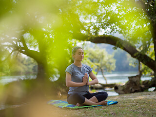 Image showing woman meditating and doing yoga exercise