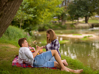 Image showing Couple in love enjoying picnic time